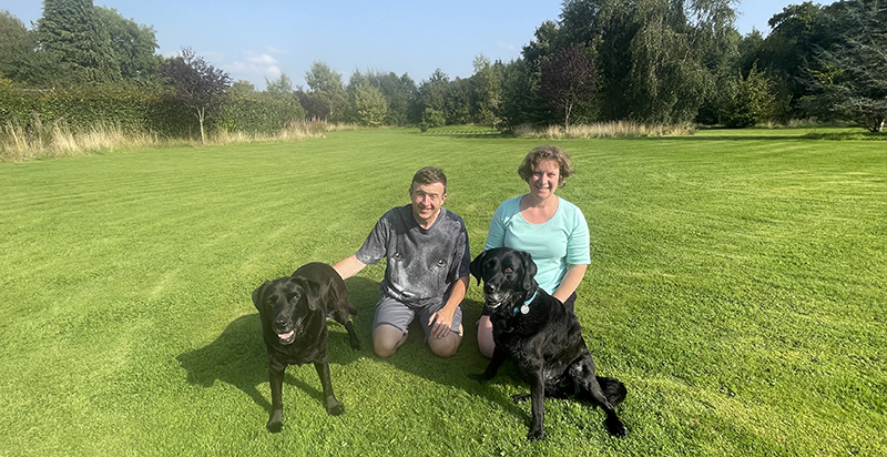 Janice and Jim with their two dogs